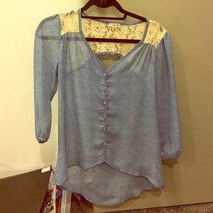 Quarter sleeve button down shirt. Sheer fabric.