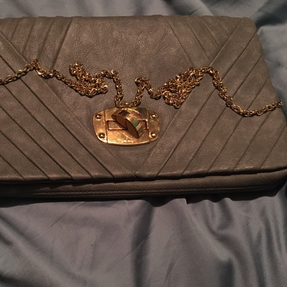 A crossover bag it is cute and it is grey