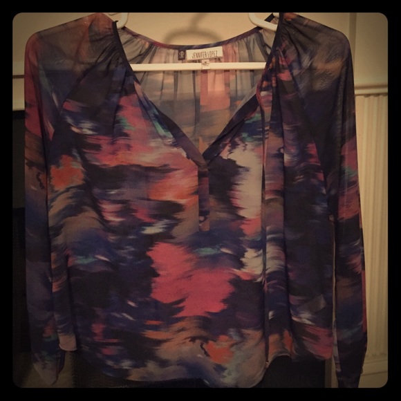 Jennifer Lopez long sleeve sheer like top.