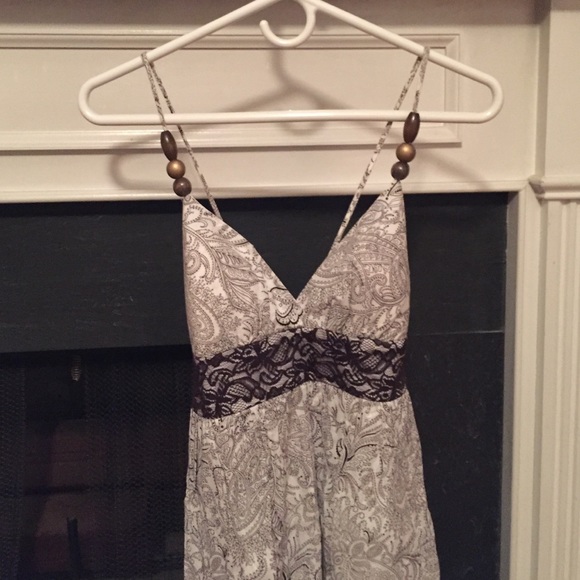 White and brown dress with lace design.