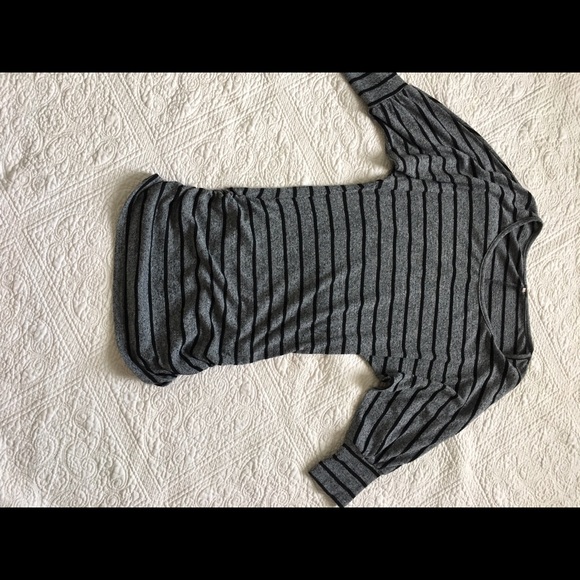 Sweater dress with side gathering.