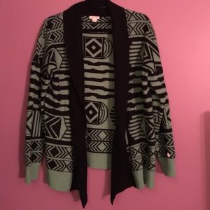 Green and black Aztec designed sweater.