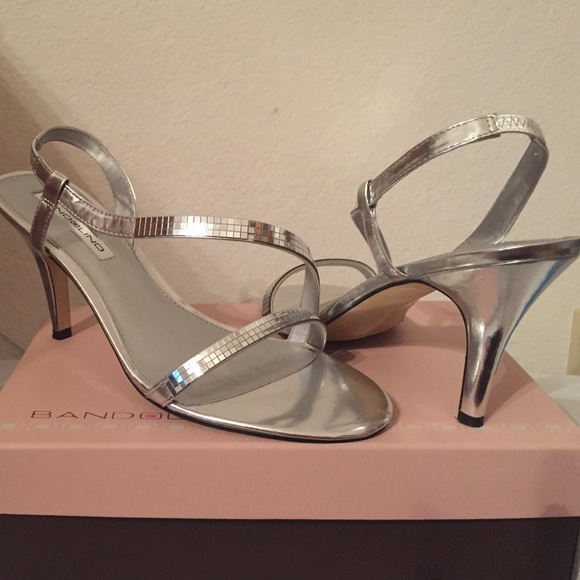 Brand new silver ladies sling backs.