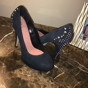 Black studded pumps