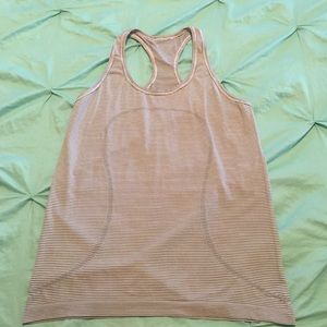 Run swiftly racerback tank