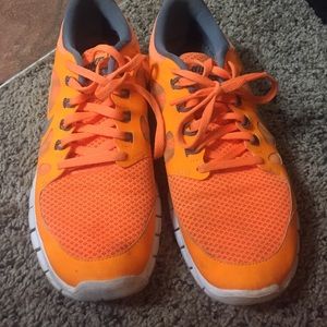 Size 7 Nike shoes bright orange