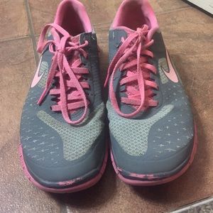 Gray and pink Nike tennis shoes size 7.5