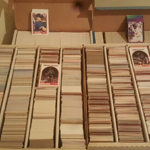 A collection of baseball and basketball cards
