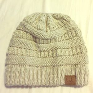 Cream colored beanie. One size.