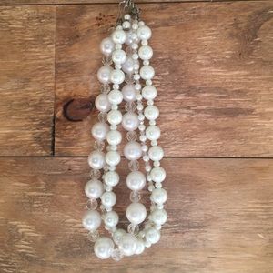 Faux pearl necklace.