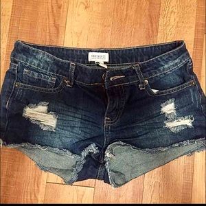Destroyed denim shorts