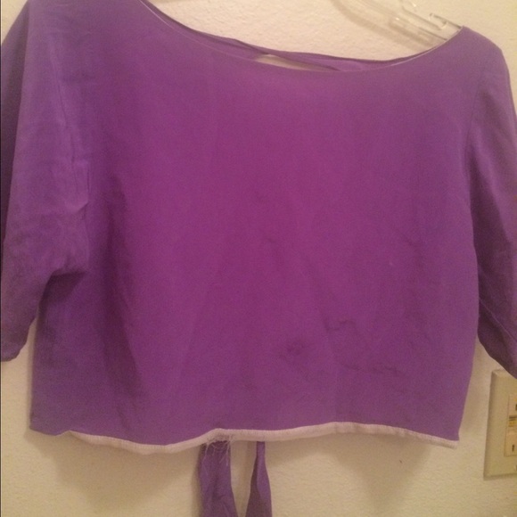 Purple crop top, with open back.