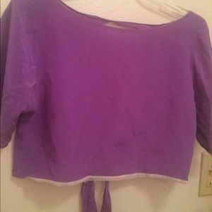 Purple crop top, with open back.