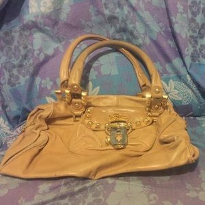 Betsy Johnson purse comes with a dust bag