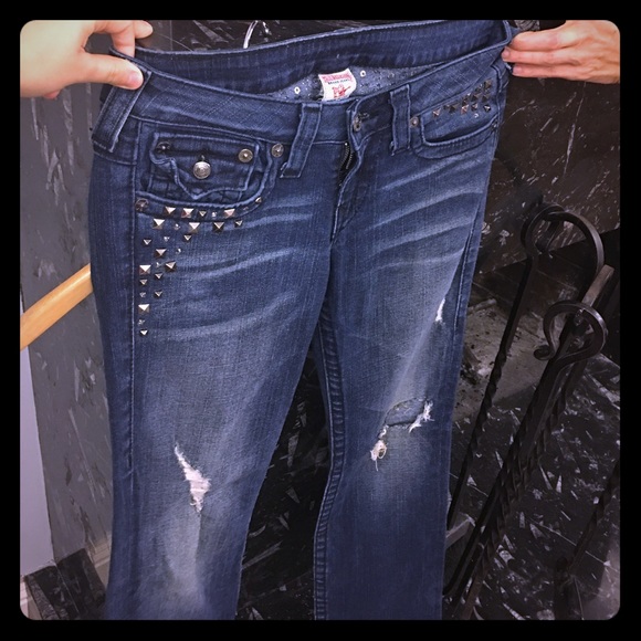 I am selling ripped studded True Religion jeans