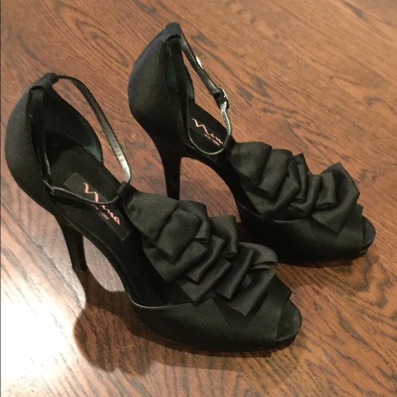 Fancy high heel black satin shoes.