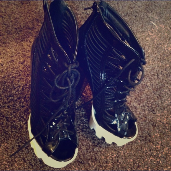 Black lace up platforms.