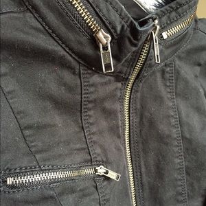 Black jacket with zipper accents