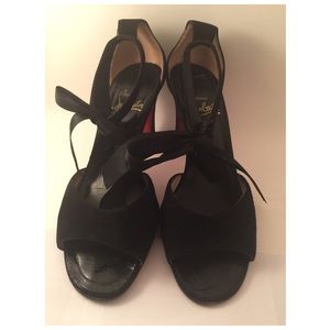 Black suede High Heel shoe w/tie at ankles.