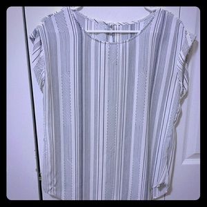 Cap sleeve patterned blouse.