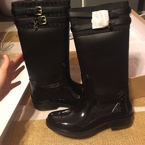 Brand new size 5 Michael Kors Boots. Worn once