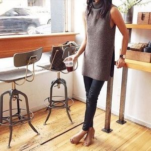Sleeveless turtleneck tunic with split sides