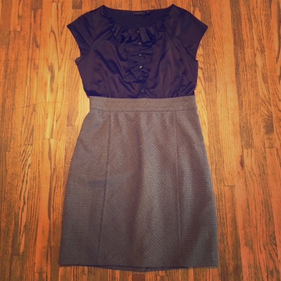 Limited dress with ruffle button detail.