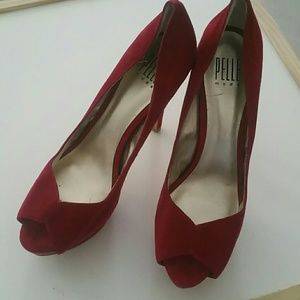 Red leather suede pumps.