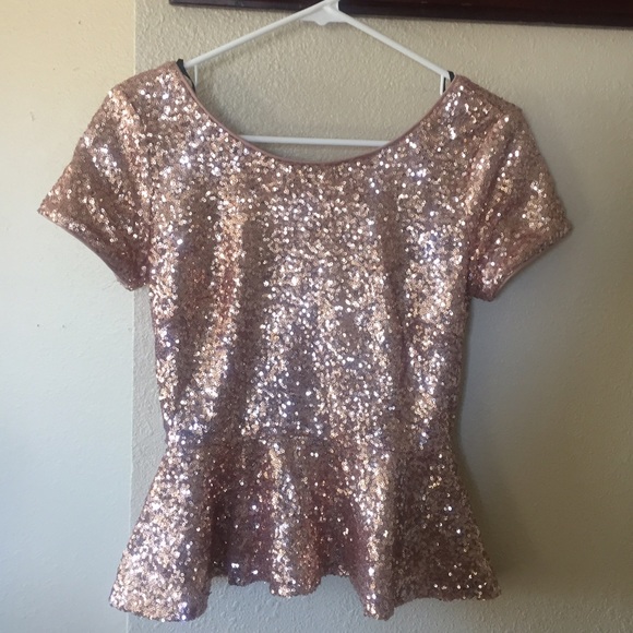 Gold sequin peplum top.