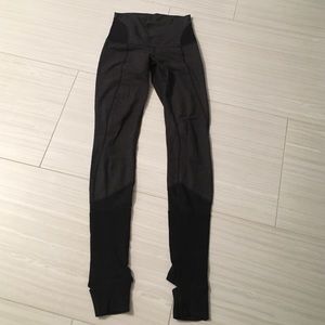 Women's Lululemon leggings with heel cut outs.
