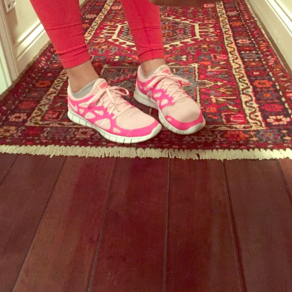Neon pink Nike running shoes