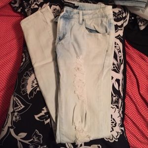 Distressed, washed out light blue jeans