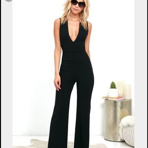 Black jumpsuit low cut cross flare