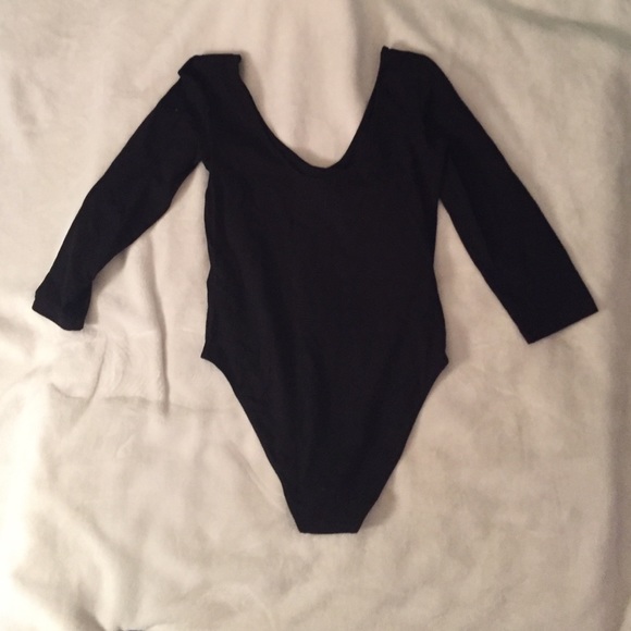 Black, long sleeve body-suit.