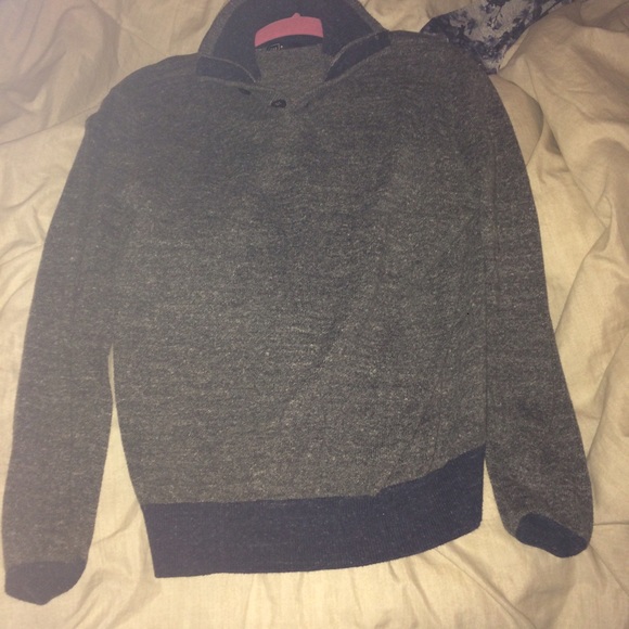 Grey and navy blue pullover.