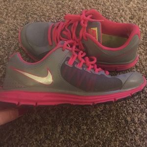 Grey and pink Nike athletic shoes
