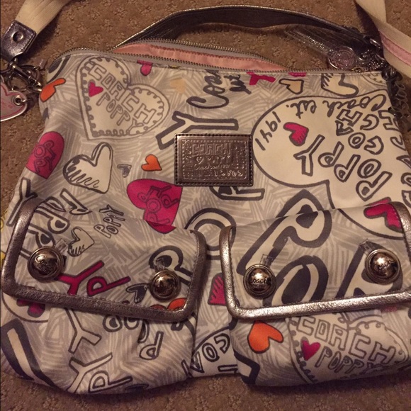 Used Coach poppy graffiti pocket hobo with charms