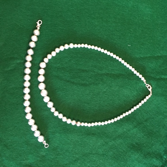Silver necklace and bracelet set.