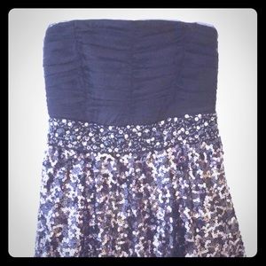 Strapless black and gold dress with sequin skirt