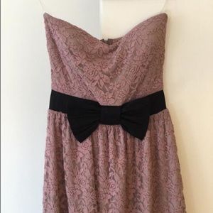Strapless light purple dress with black bow