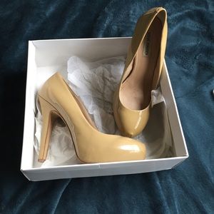 Blush patent leather pumps