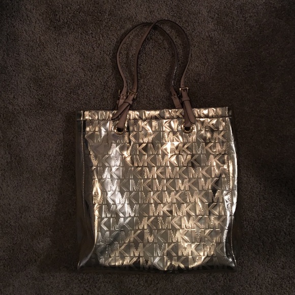 Michael Kori gold metallic bag