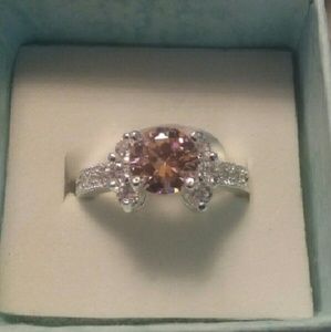 Round cut pink CZ ring