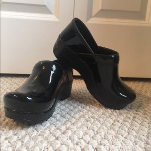 Dansko patent leather clogs