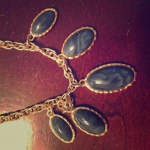 Long gold Anne Taylor necklace w/dark blue stones