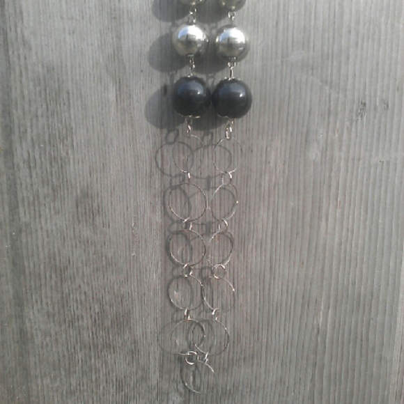 Silver tone and black beaded necklace.