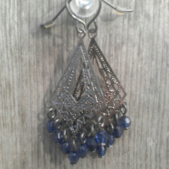 Pewter color and blue earrings. Pierced.