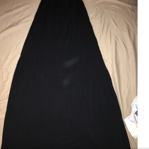 Long black dress with two slits at the side.