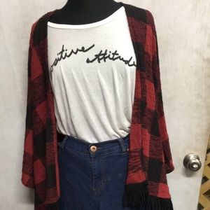 Red and black plaid kimono with black fringe.
