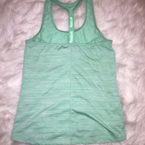 Reebok training top color teal blue.